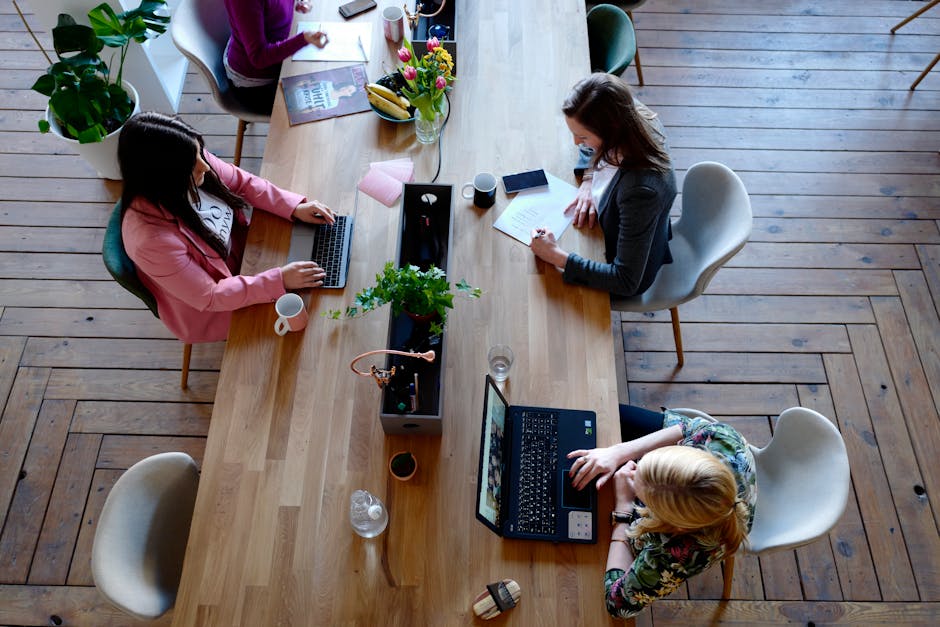 A diverse team discussing AI art marketing strategies in a modern office