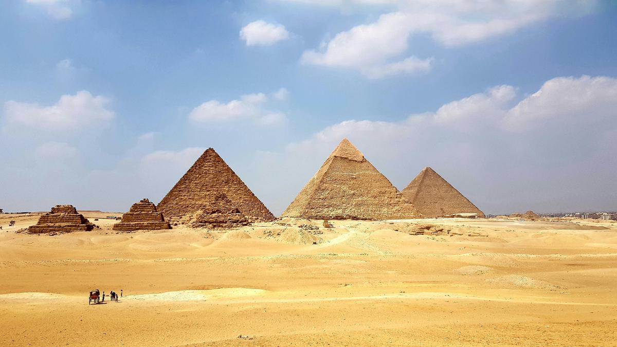 The majestic ancient Egyptian pyramids of Giza, their triangular geometry symbolizing spiritual ascension and divine connection