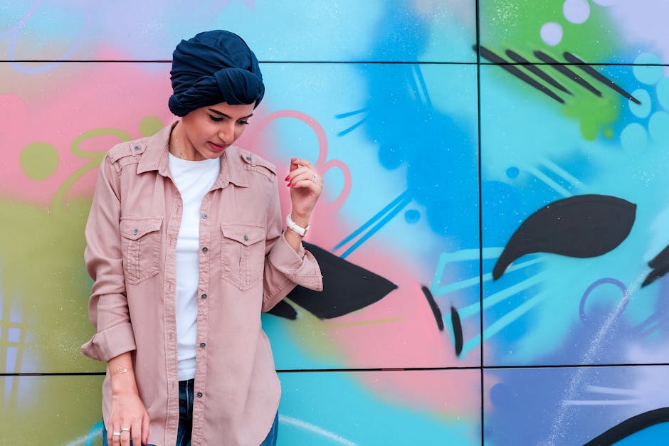A bustling scene on Brick Lane, where numerous colourful murals and graffiti adorn the walls, creating an immersive and ever-changing urban gallery.