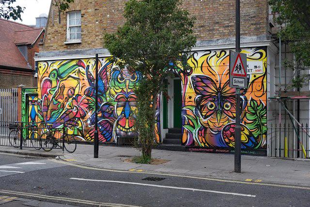 A striking mural on Camden High Street, featuring vibrant colours and intricate designs that reflect the area's eclectic and creative atmosphere.