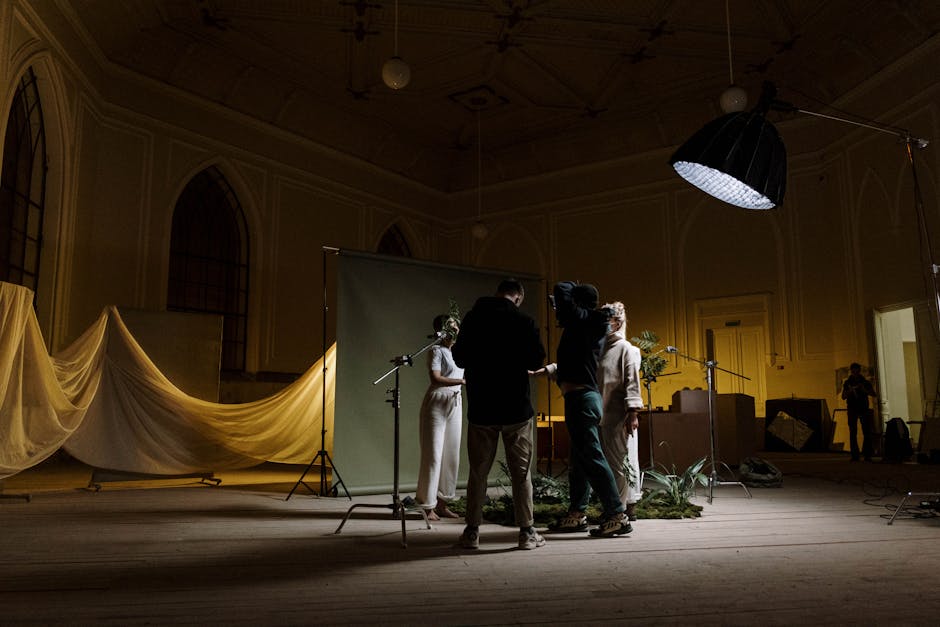 A behind-the-scenes view of a political photoshoot, showing the careful staging and lighting setup