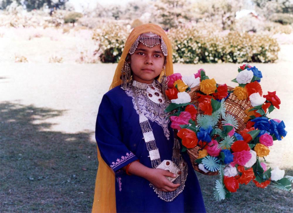 A detailed portrait of a person wearing traditional attire with symbolic elements representing their cultural heritage