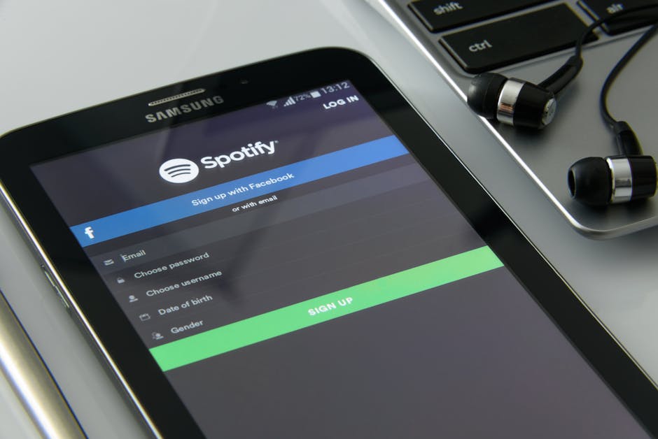 Various digital devices displaying popular music streaming platforms