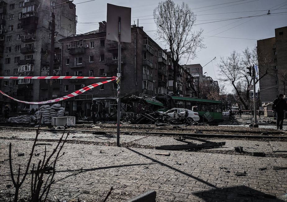 An image depicting the devastating aftermath of the bombing of Guernica, with buildings reduced to ruins and smoke rising from the debris.