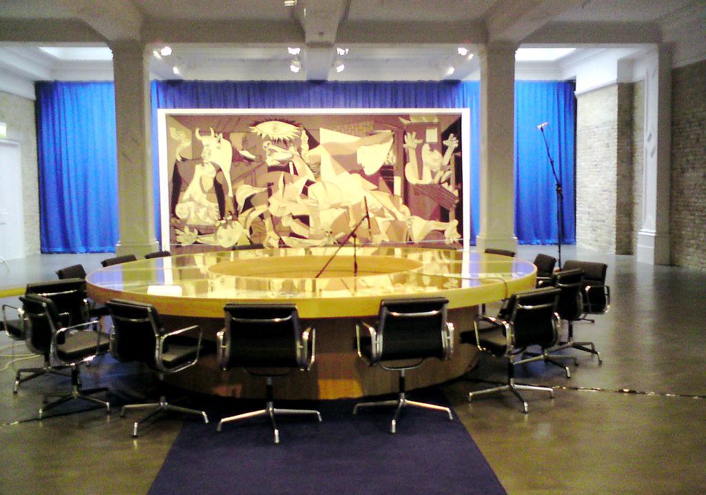 The tapestry version of Picasso's Guernica hanging at the entrance to the United Nations Security Council Chamber in New York. The large-scale textile reproduction of the painting serves as a poignant backdrop for world leaders discussing matters of international peace and security, its anti-war message a constant reminder of the importance of their deliberations.