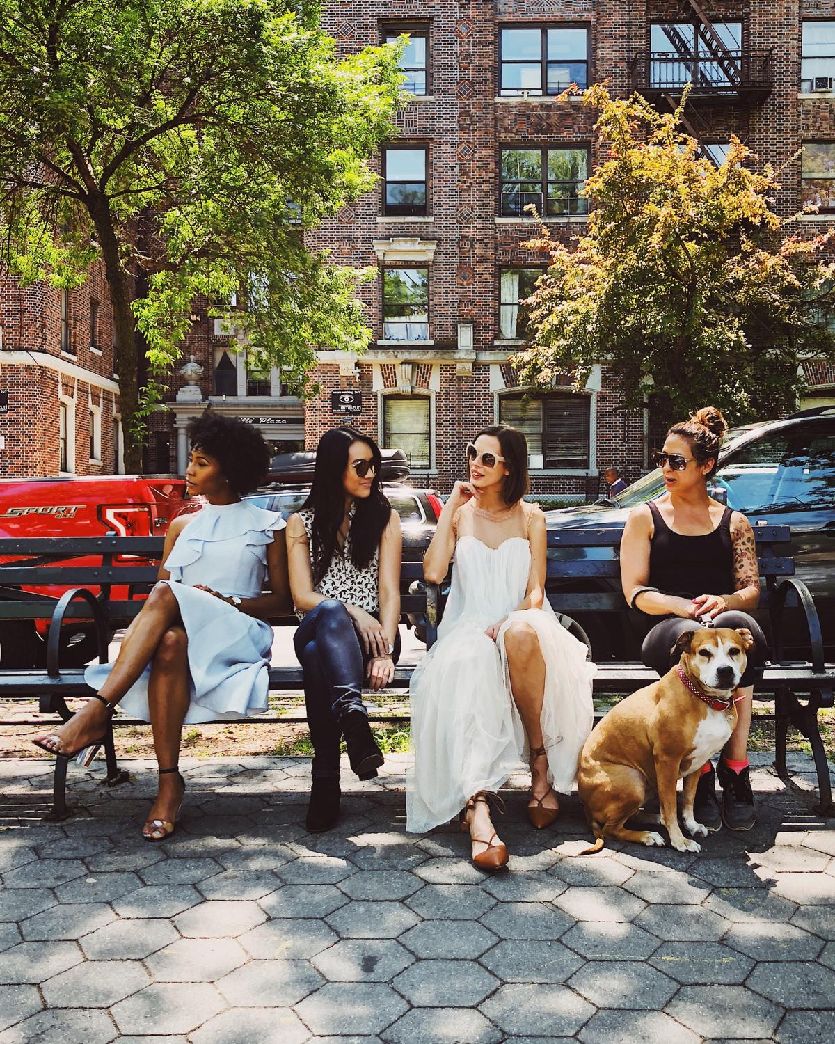 A group of women artists working in a studio, showcasing diversity and creativity, representing the overlooked achievements of female artists.