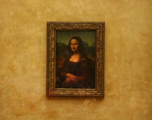 Portrait of the Mona Lisa by Leonardo da Vinci, showcasing her enigmatic smile and the masterful use of light and shadow