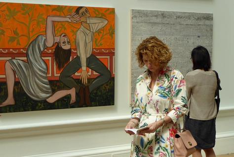 Members of the Royal Academy's Selection and Hanging Committee carefully evaluating artworks, engaging in discussions, and collaborating to curate the Summer Exhibition.
