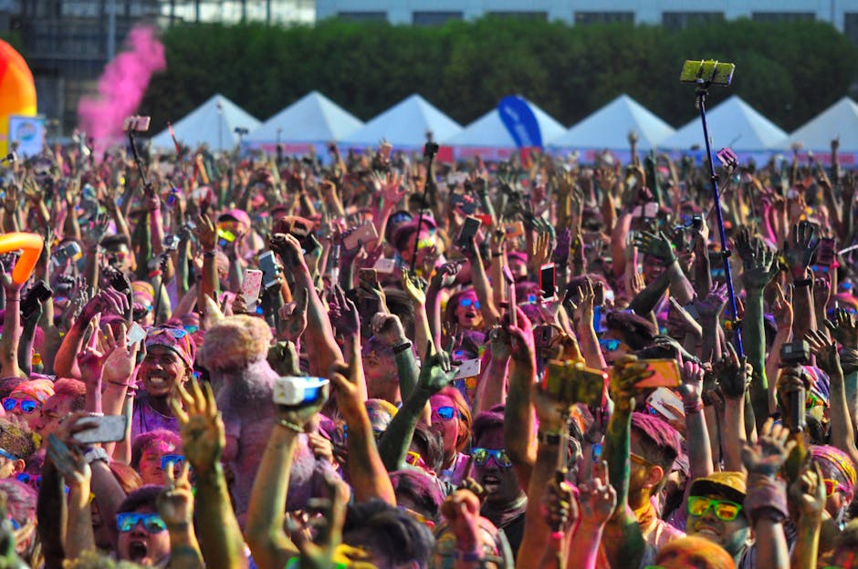 A diverse group of people taking selfies in various settings, showcasing the cultural impact of the phenomenon