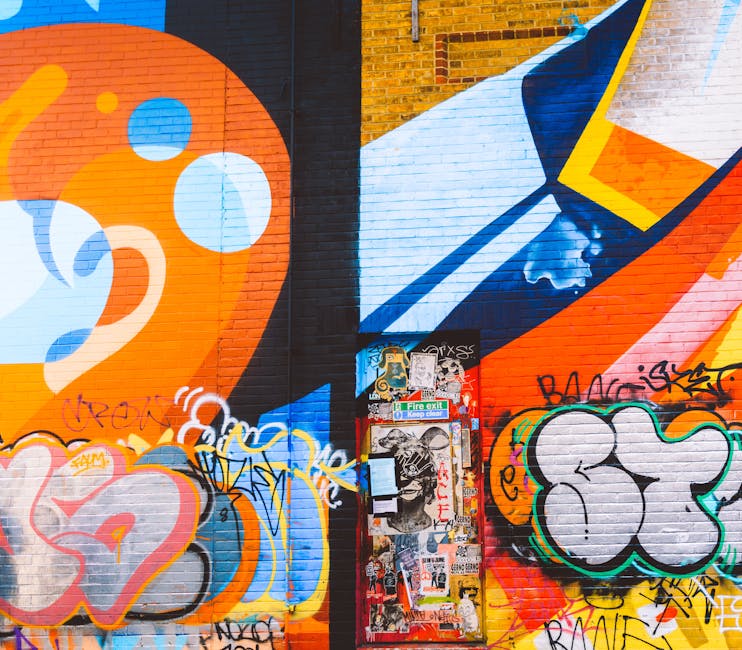 A collection of vibrant street art in Shoreditch, including murals, graffiti, and installations that showcase the area's thriving creative scene.