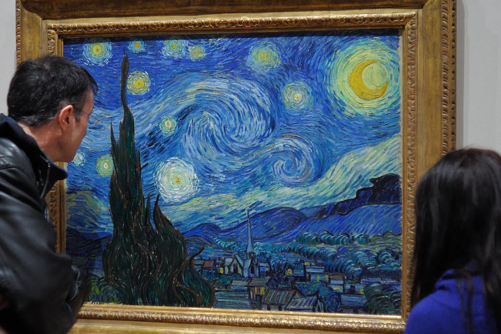 The Starry Night painting displayed prominently in a gallery at the Museum of Modern Art in New York