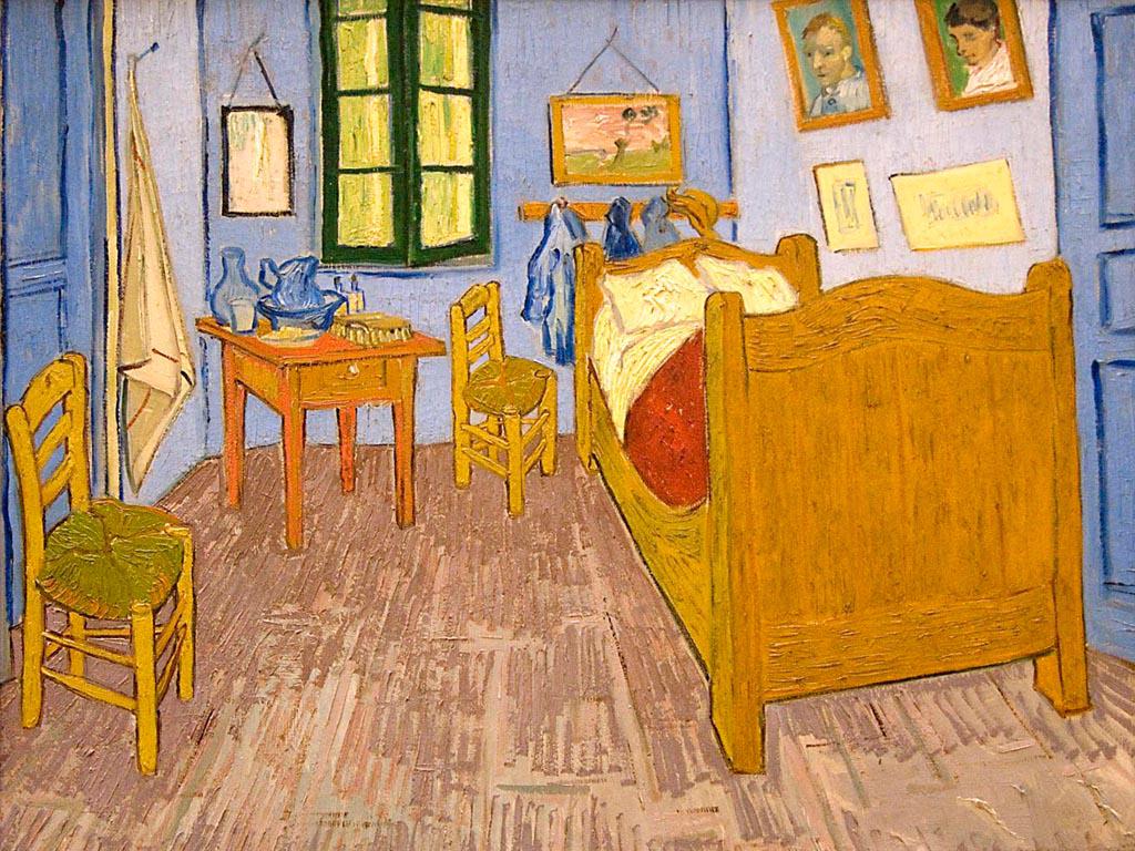 A recreation of Vincent van Gogh's room at the Saint-Paul-de-Mausole asylum, showing a simple bed, a chair, and an easel near a window with a view of the night sky