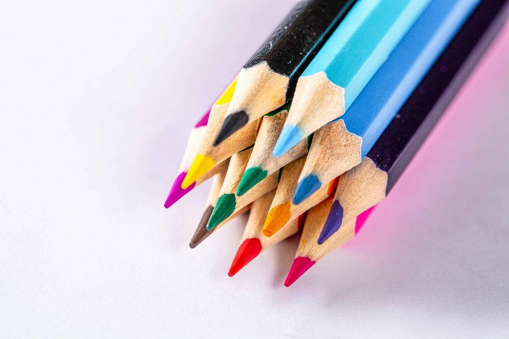 A collection of high-quality colored pencils arranged in a vibrant and artistic manner, showcasing their intense pigmentation and blending capabilities.