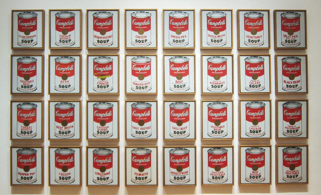 Andy Warhol's '32 Campbell's Soup Cans' artwork, showcasing the concept of repetition and mass production in pop art.