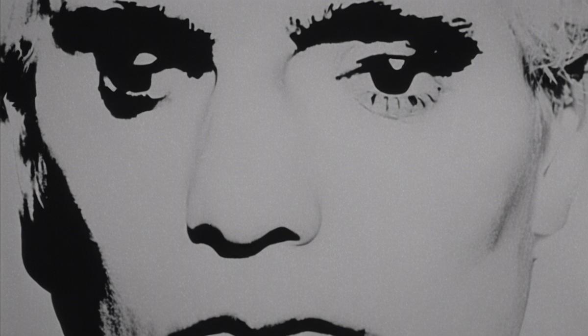 A still from one of Andy Warhol's Screen Tests, featuring a close-up of a person's face in black and white