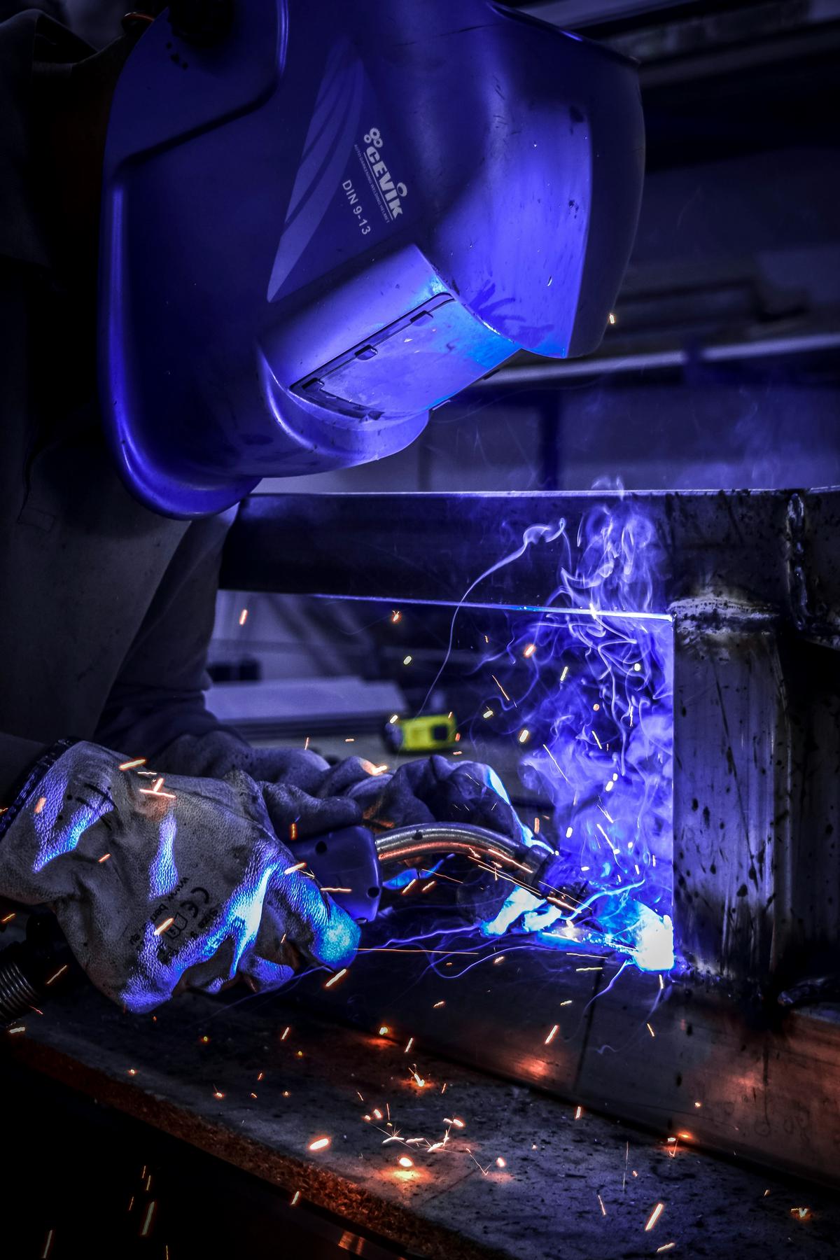 Close-up of welding and brazing techniques used in creating a political steel sculpture