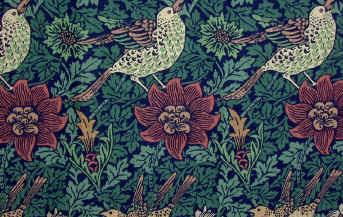 A William Morris wallpaper design featuring intricate floral patterns in rich colors